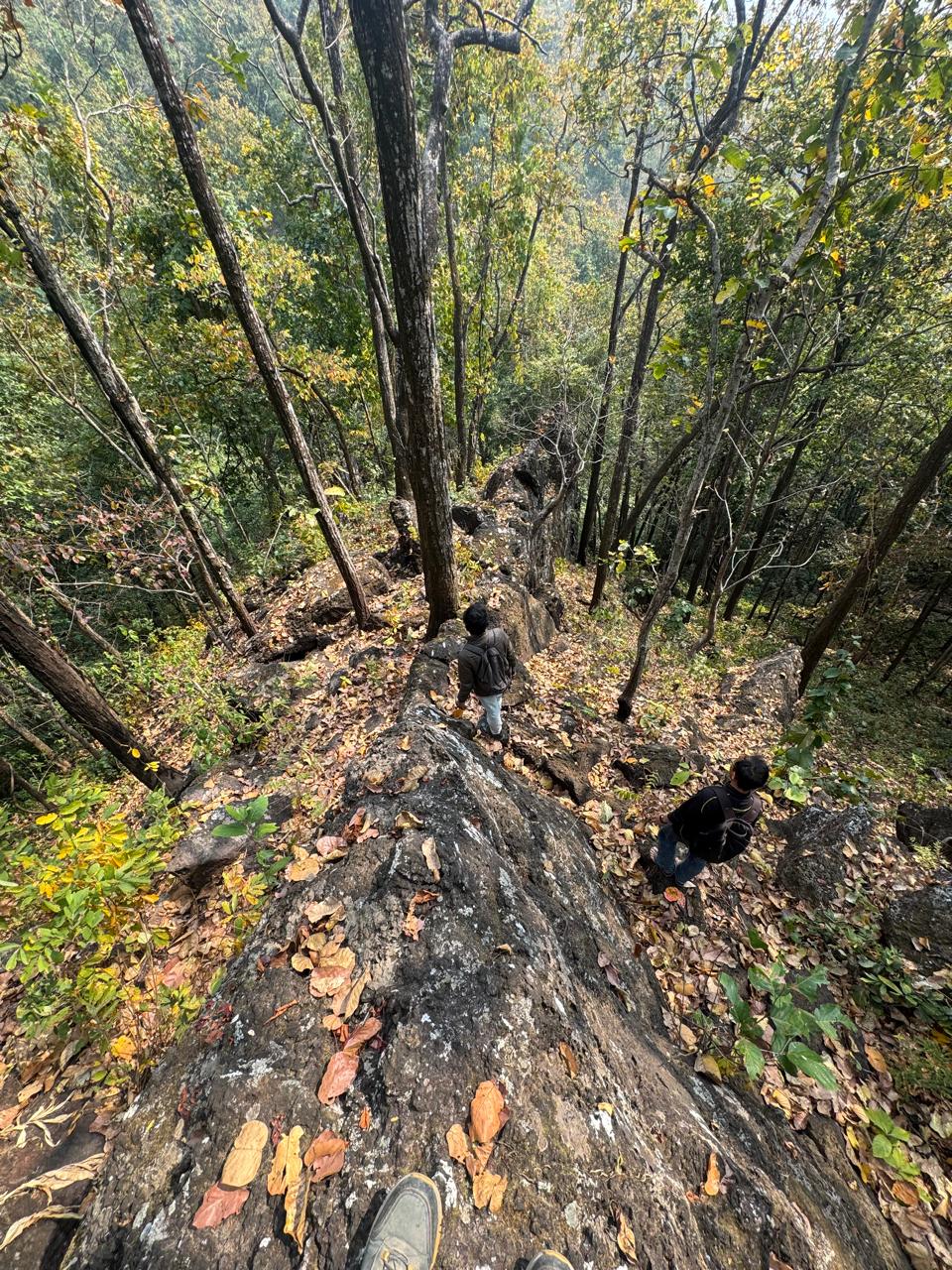 Field geologist standing beside a rocky exposure in Bagmati, Makwanpur