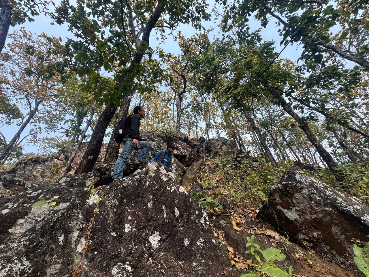Field team moving across a rocky iron prospecting ridge in Bagmati, Makwanpur