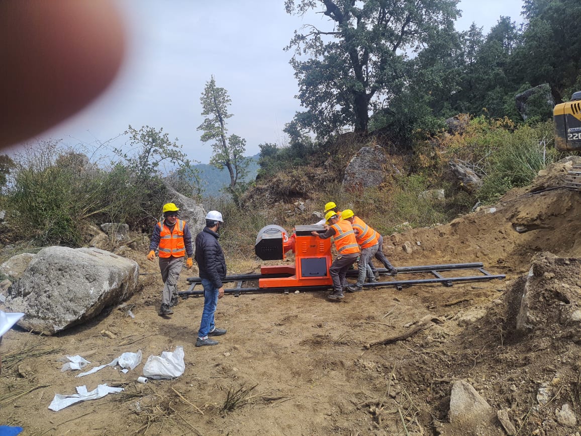 Close-up of on-site machine and operating crew